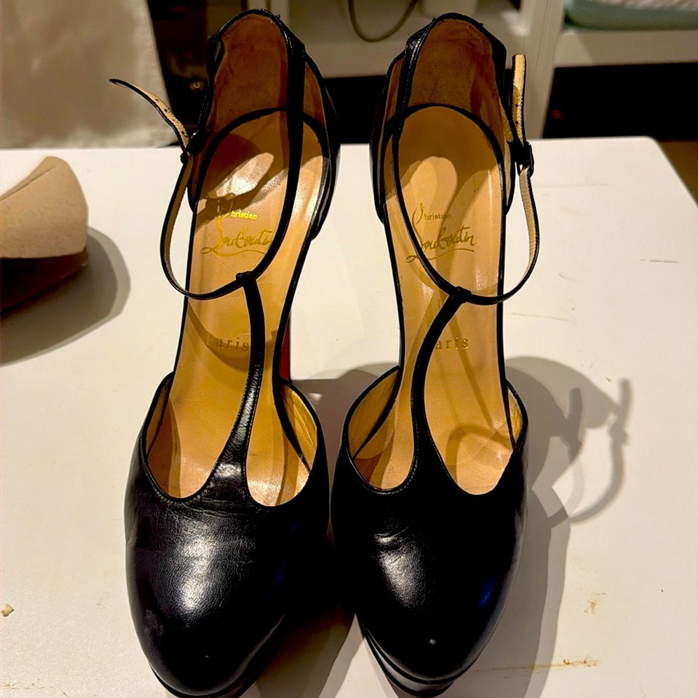 Christian Louboutin black leather platform T-bar heels.